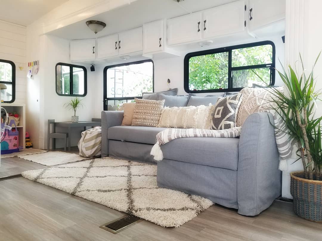 You need to see this lovely renovated 5th wheel, full-time home to a family of four and a fur baby. #RVremodel #rvrestoration #camper remodel
