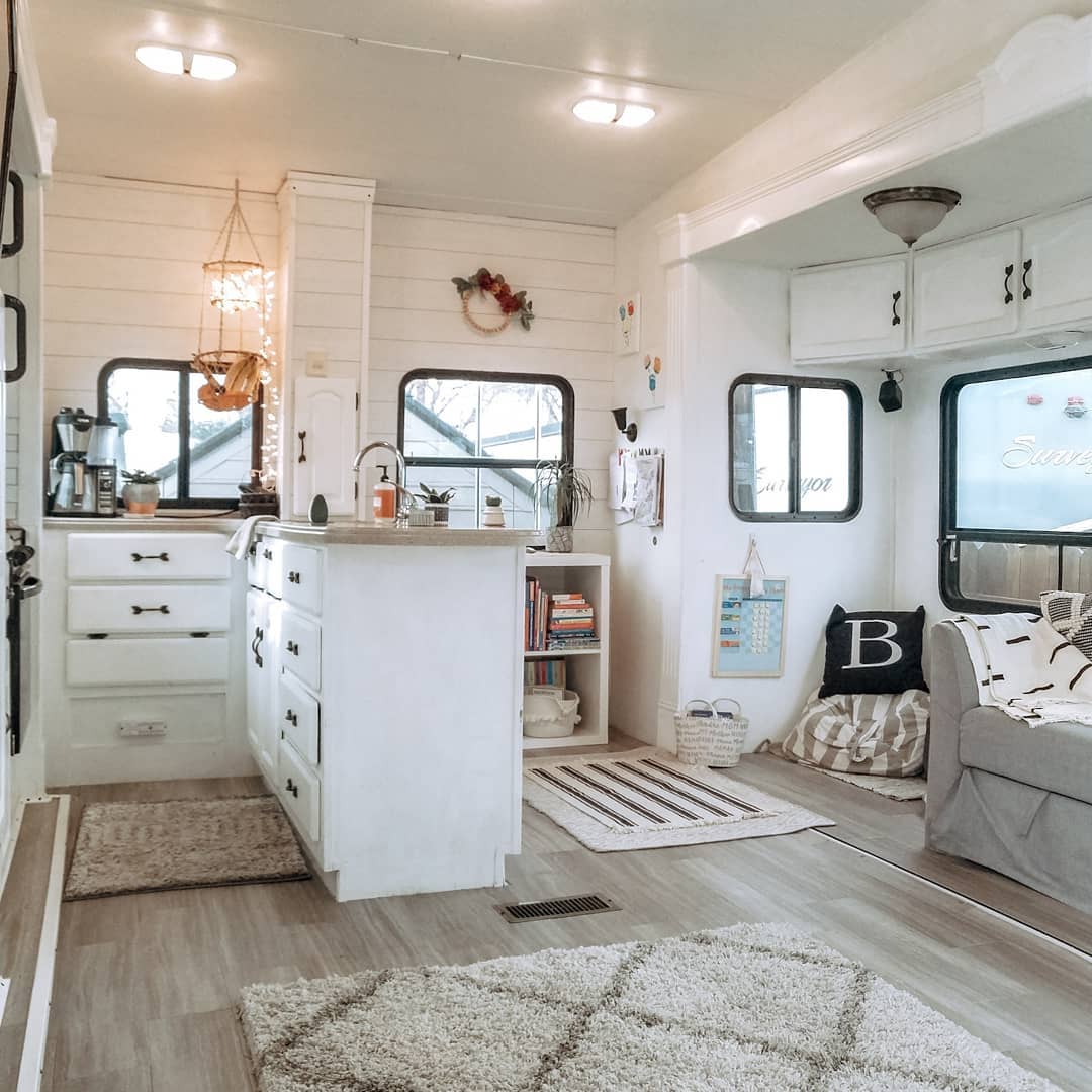 You need to see this lovely renovated 5th wheel, full-time home to a family of four and a fur baby. #RVremodel #rvrestoration #camper remodel